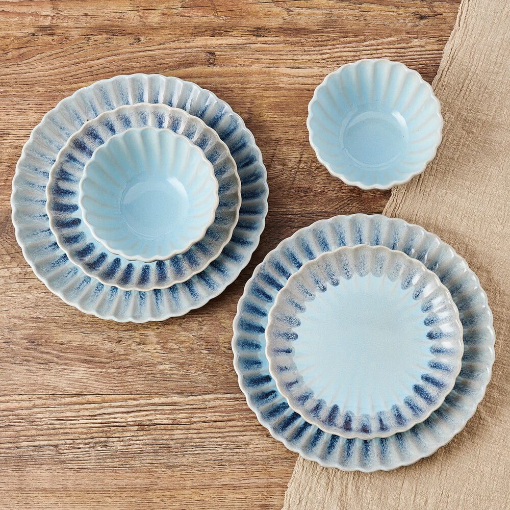 Close-up of blue gray scalloped stoneware dinner plate from the Lucinda dinnerware set
