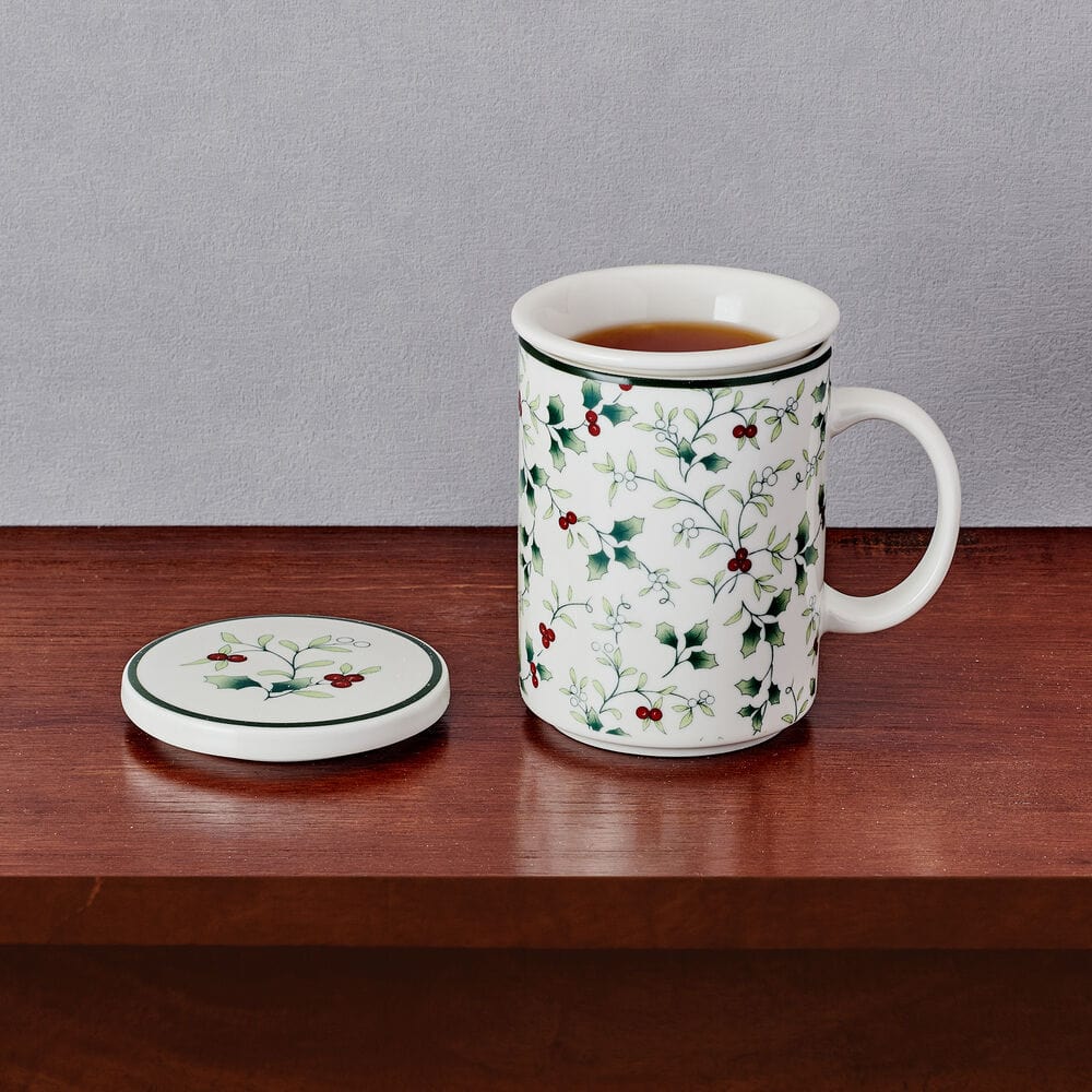 White porcelain tea mug with infuser and lid, Winterberry design, side view