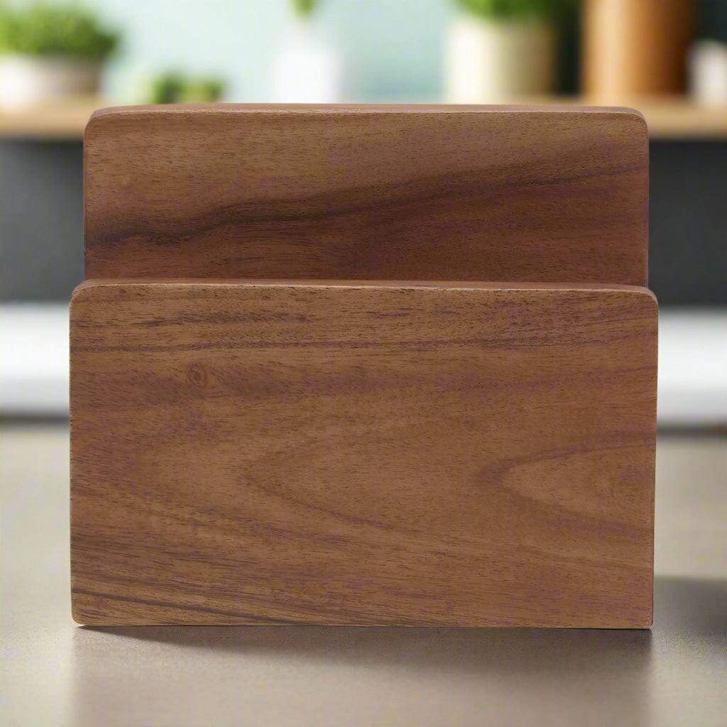 Elegant acacia wood napkin holder displaying its unique design on a dining table.
