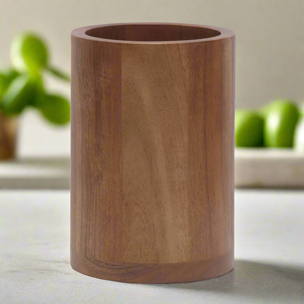 Rustic acacia wood utensil holder showcasing various kitchen tools