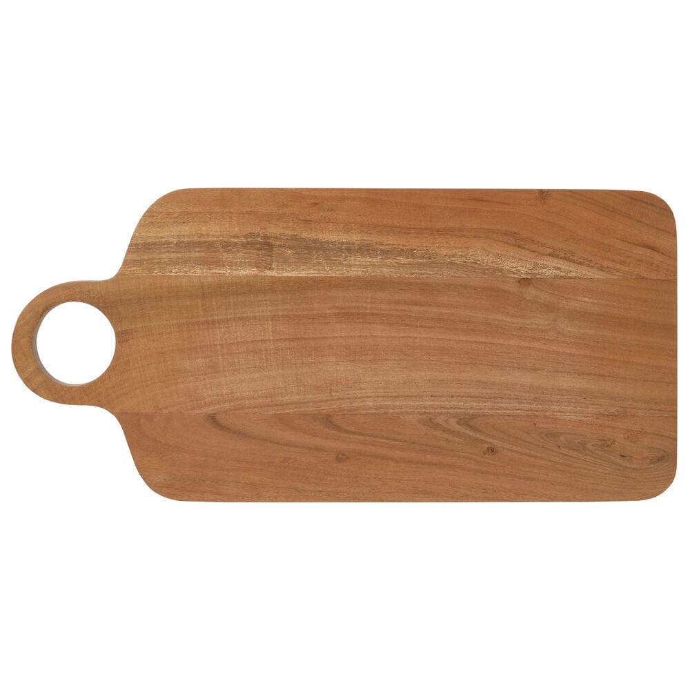 Serving board on a dining table with cheese, nuts, and wine for a party setup