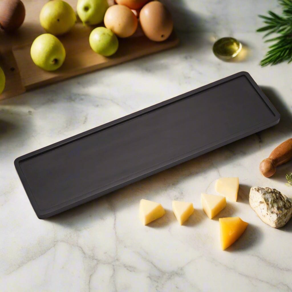 Black Mango rectangular charcuterie board with cheese, fruits, and nuts for entertaining