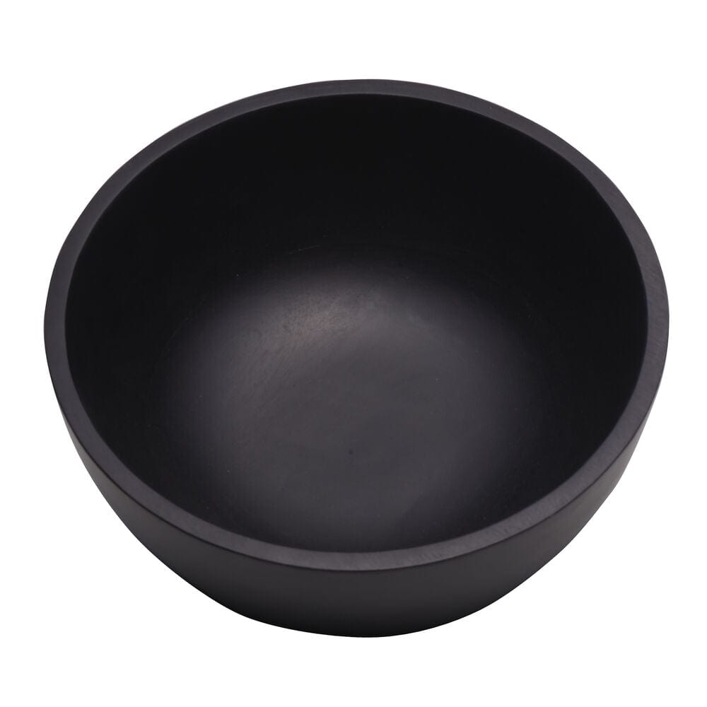 Elegant black mango wood serving bowl on a dinner table setup