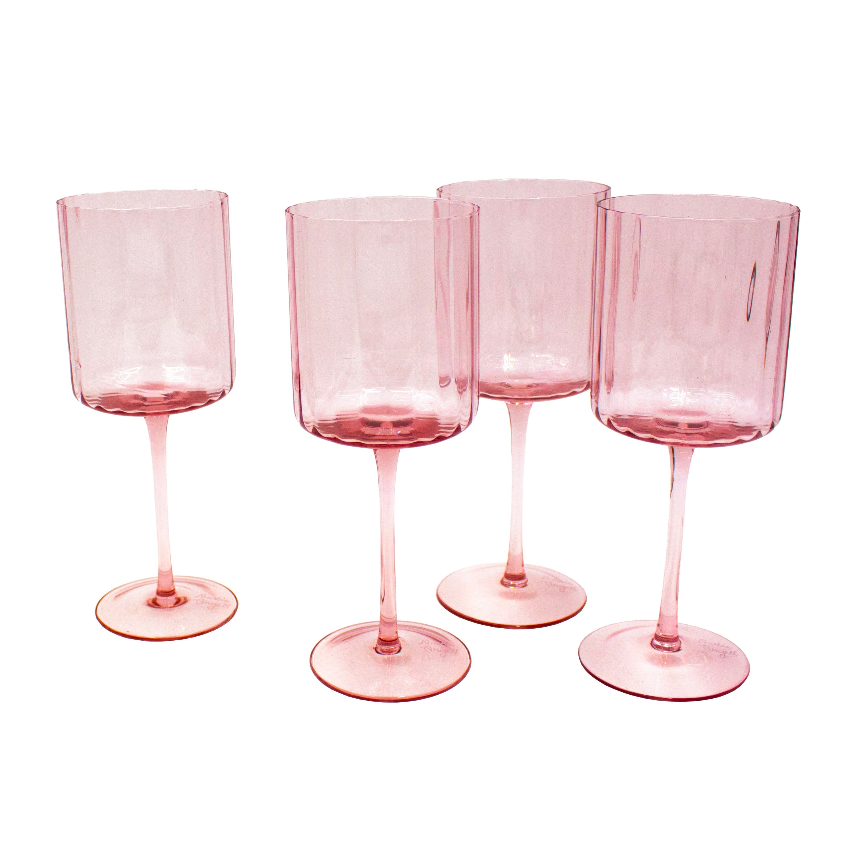 Set of 4 elegant wine glasses on a stylish dinner table