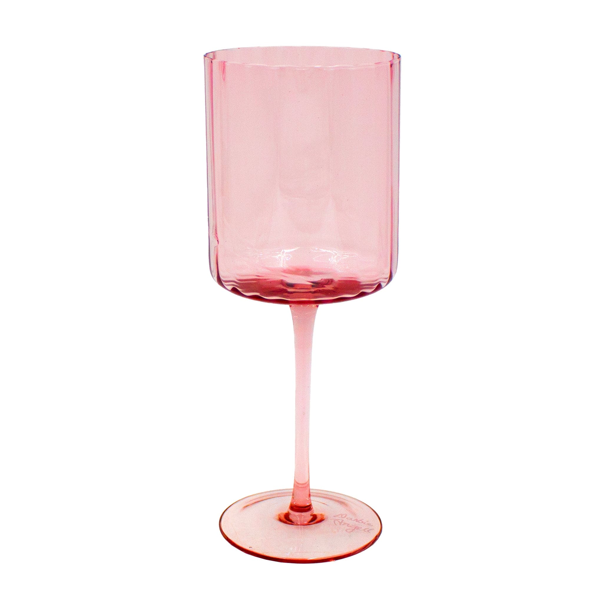 Woman pouring wine into prismatic glassware during celebration