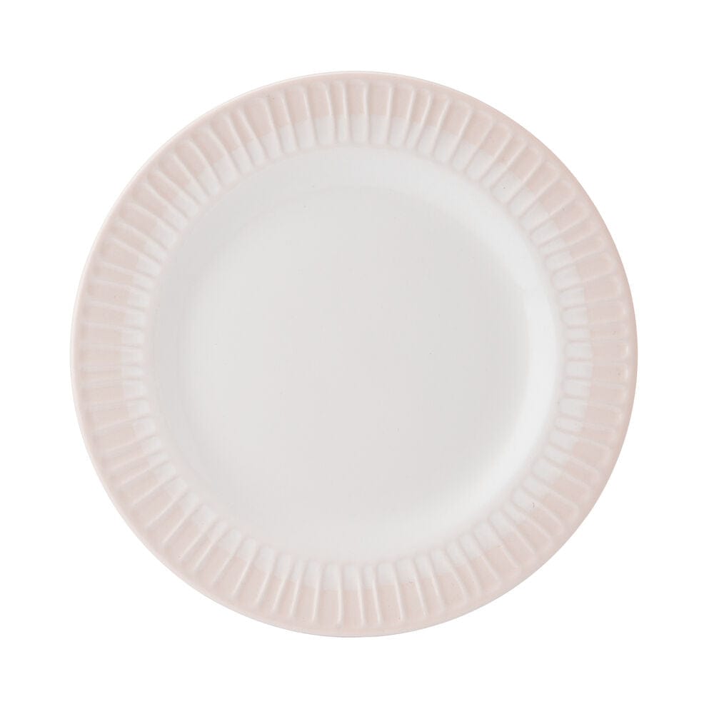 Elegant blush dinnerware set on a modern table for special occasions