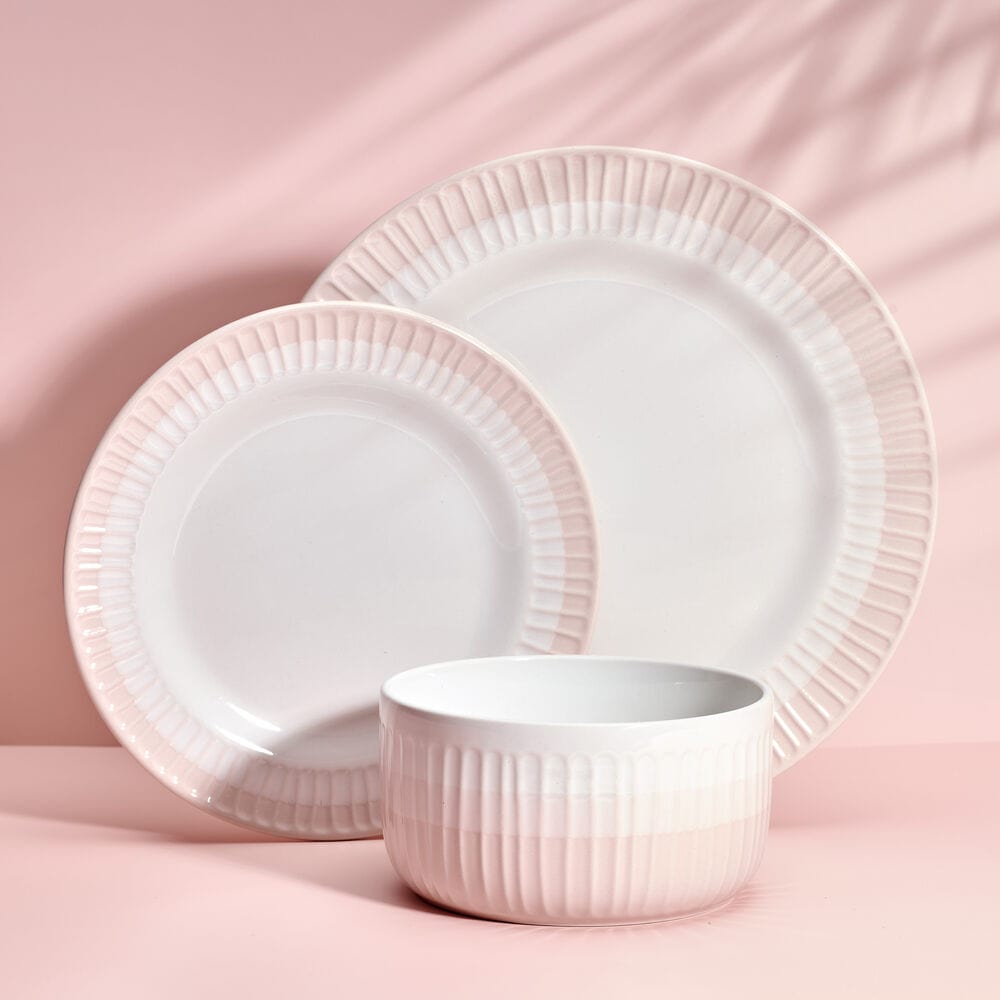 Close-up of blush dinnerware set with textured details for everyday use