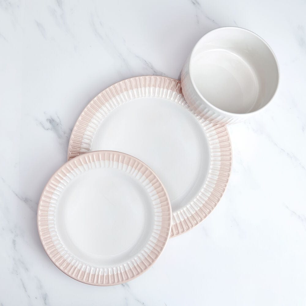 Close-up of blush dinnerware set with textured details for everyday use