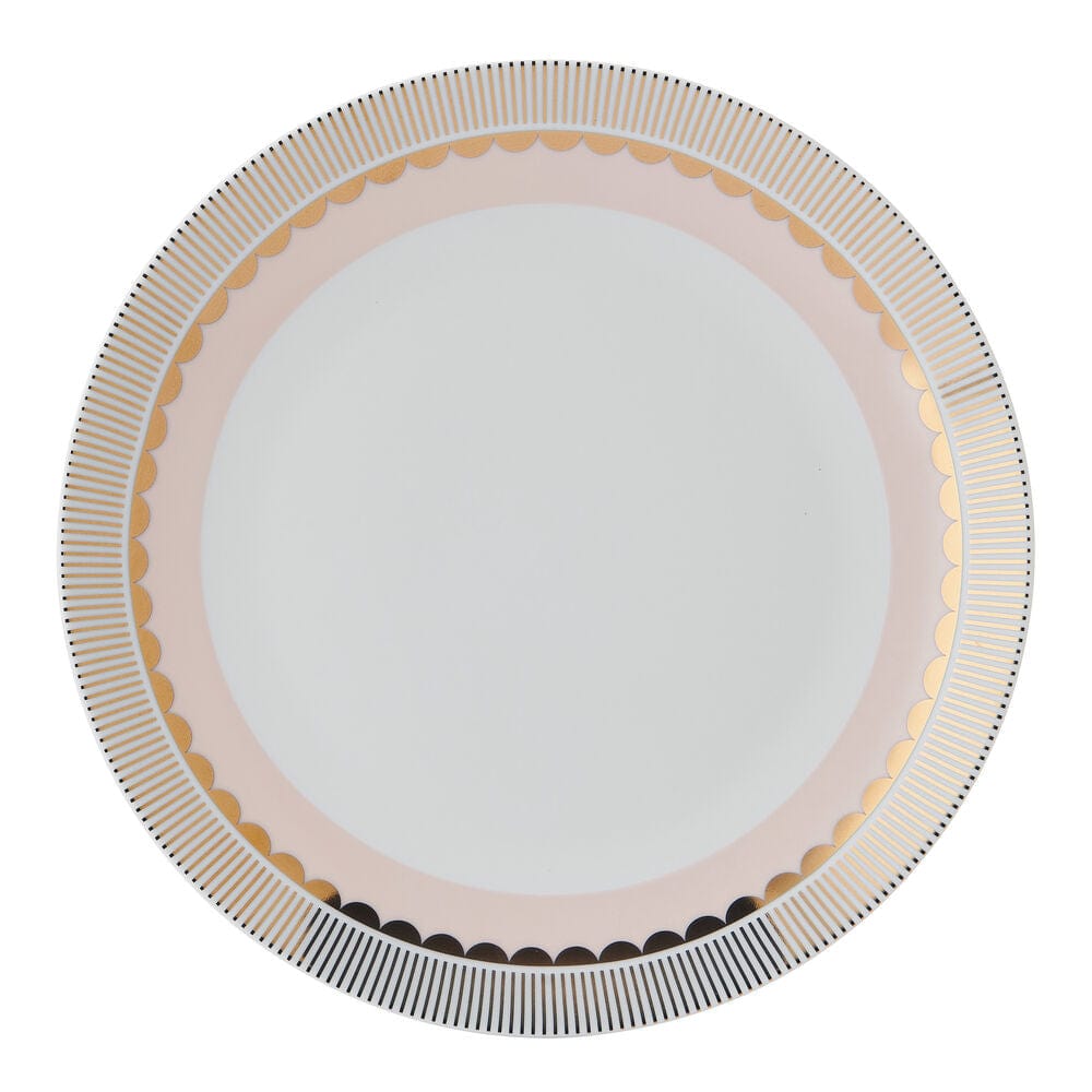 Close-up of gold and blush porcelain dinner plates with metallic rims