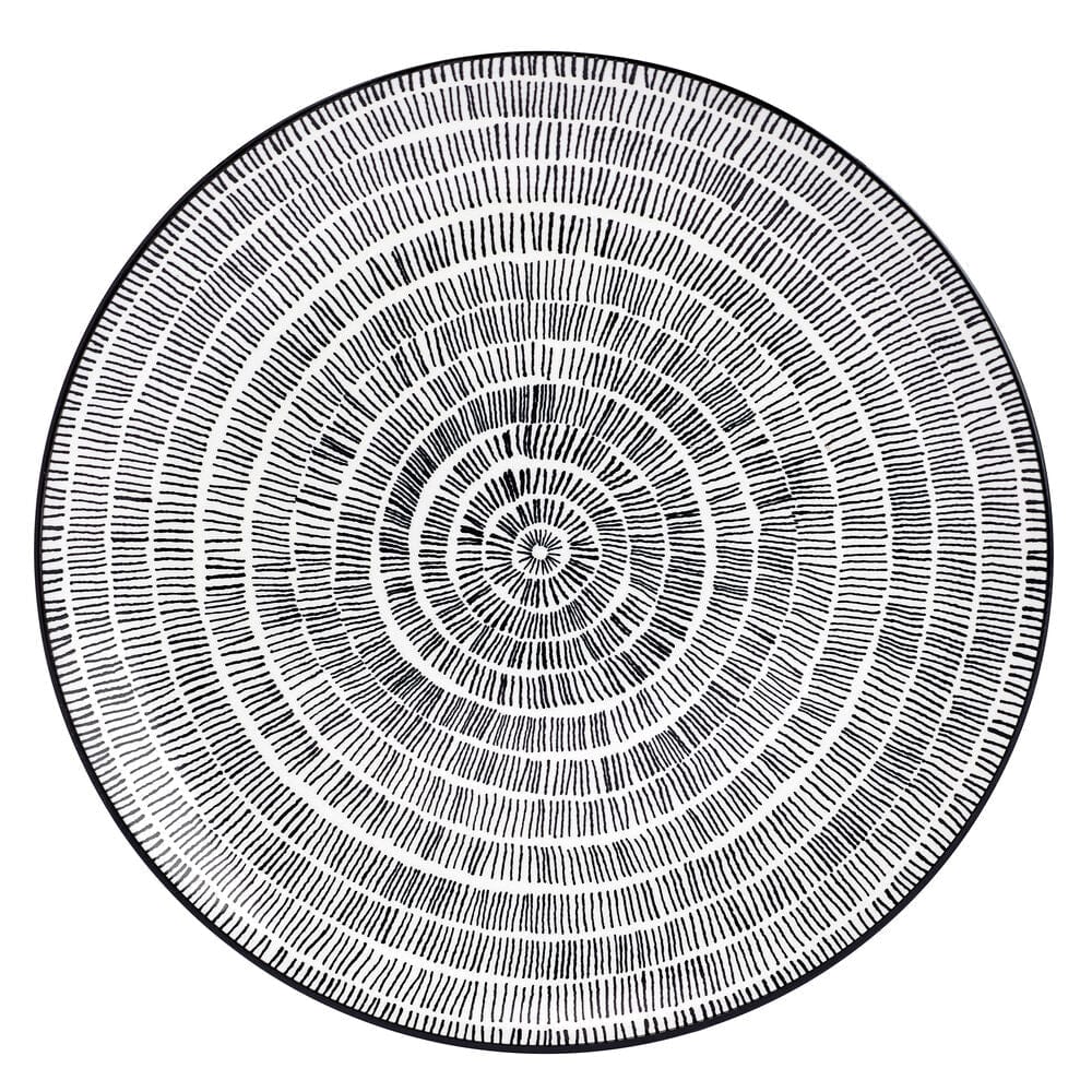 Elegant modern porcelain dinnerware set for four with artistic design on a contemporary table