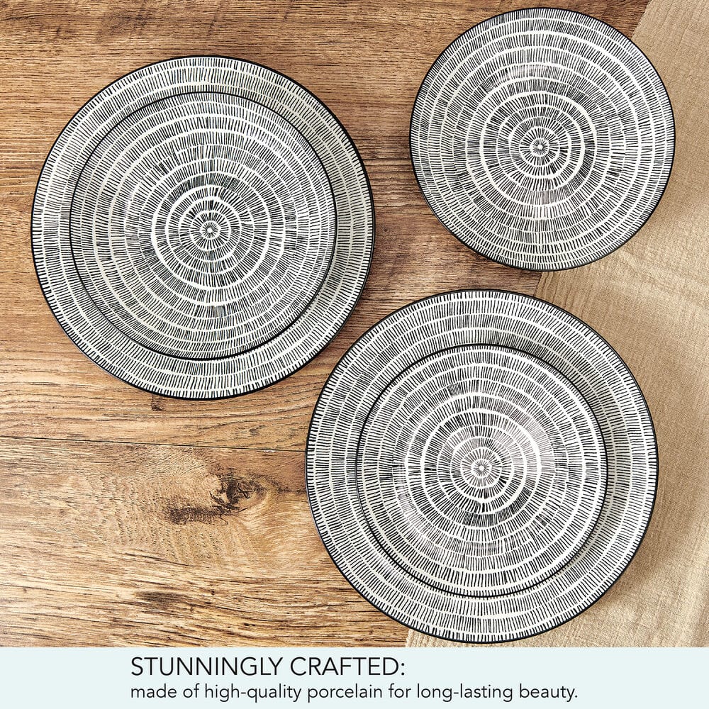 Elegant modern porcelain dinnerware set for four with artistic design on a contemporary table