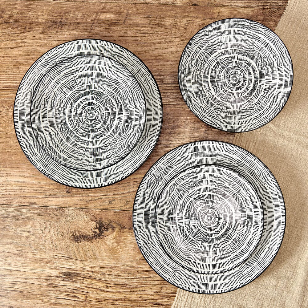 Elegant modern porcelain dinnerware set for four with artistic design on a contemporary table