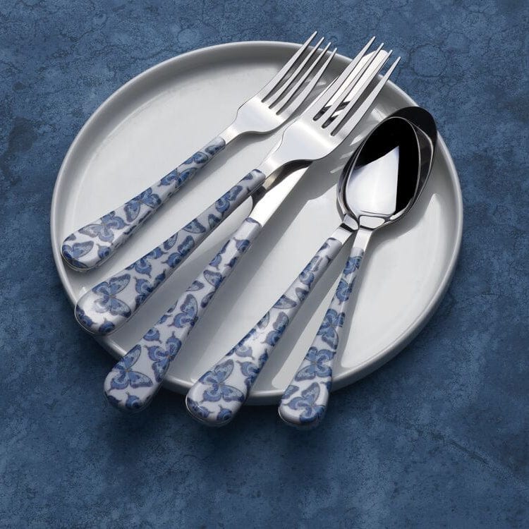Flatware set with butterfly pattern on handles, styled on a dining table for family dinners