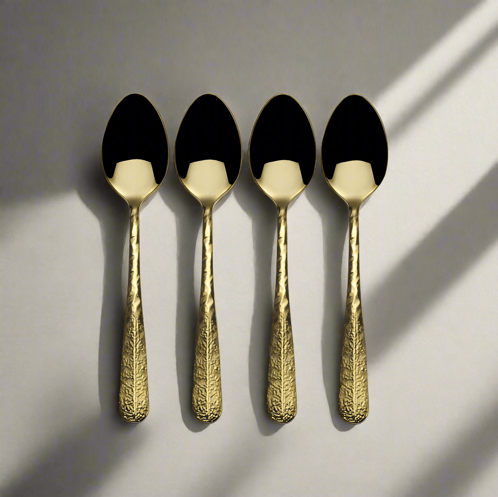 Close-up of Sable Gold Mini Coffee Spoon Set showcasing hammered finish