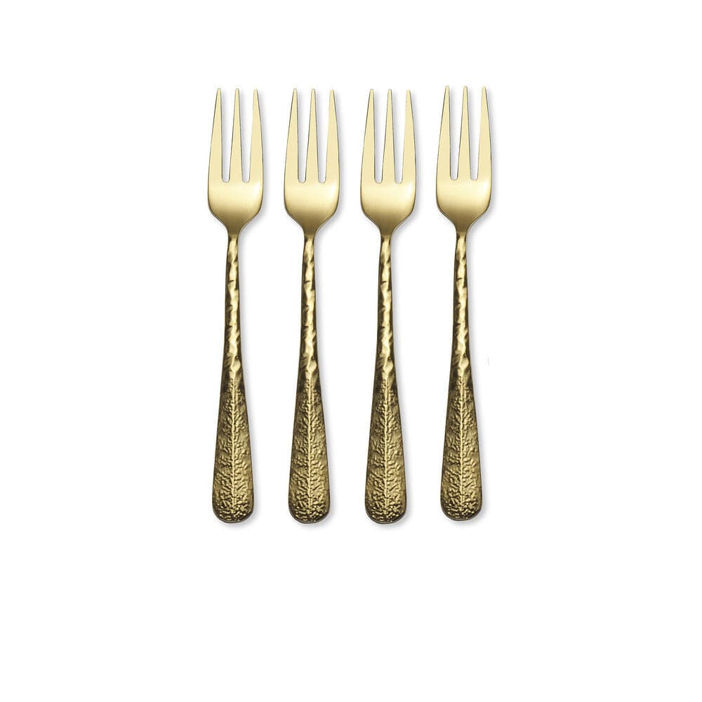 Gold serving forks arranged on a stylish table setting for parties