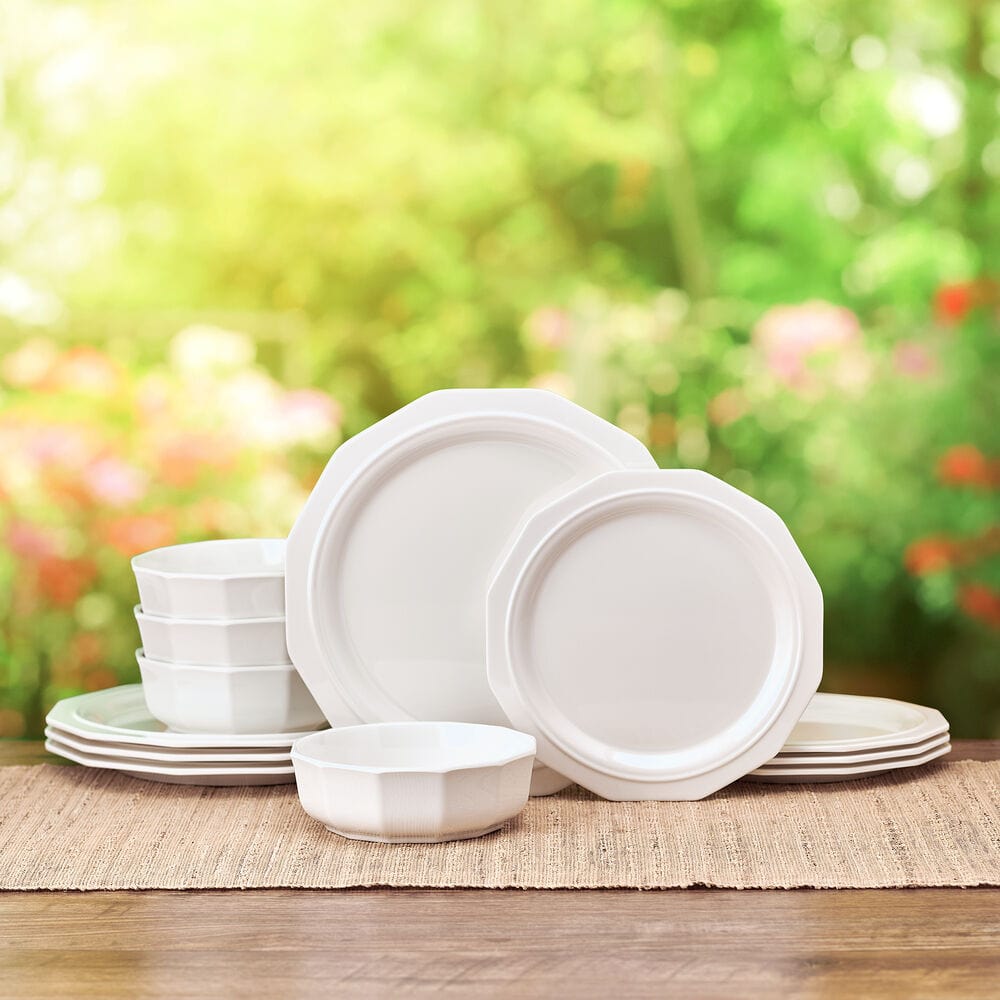 Close-up of geometric patterned melamine dinnerware on patio table