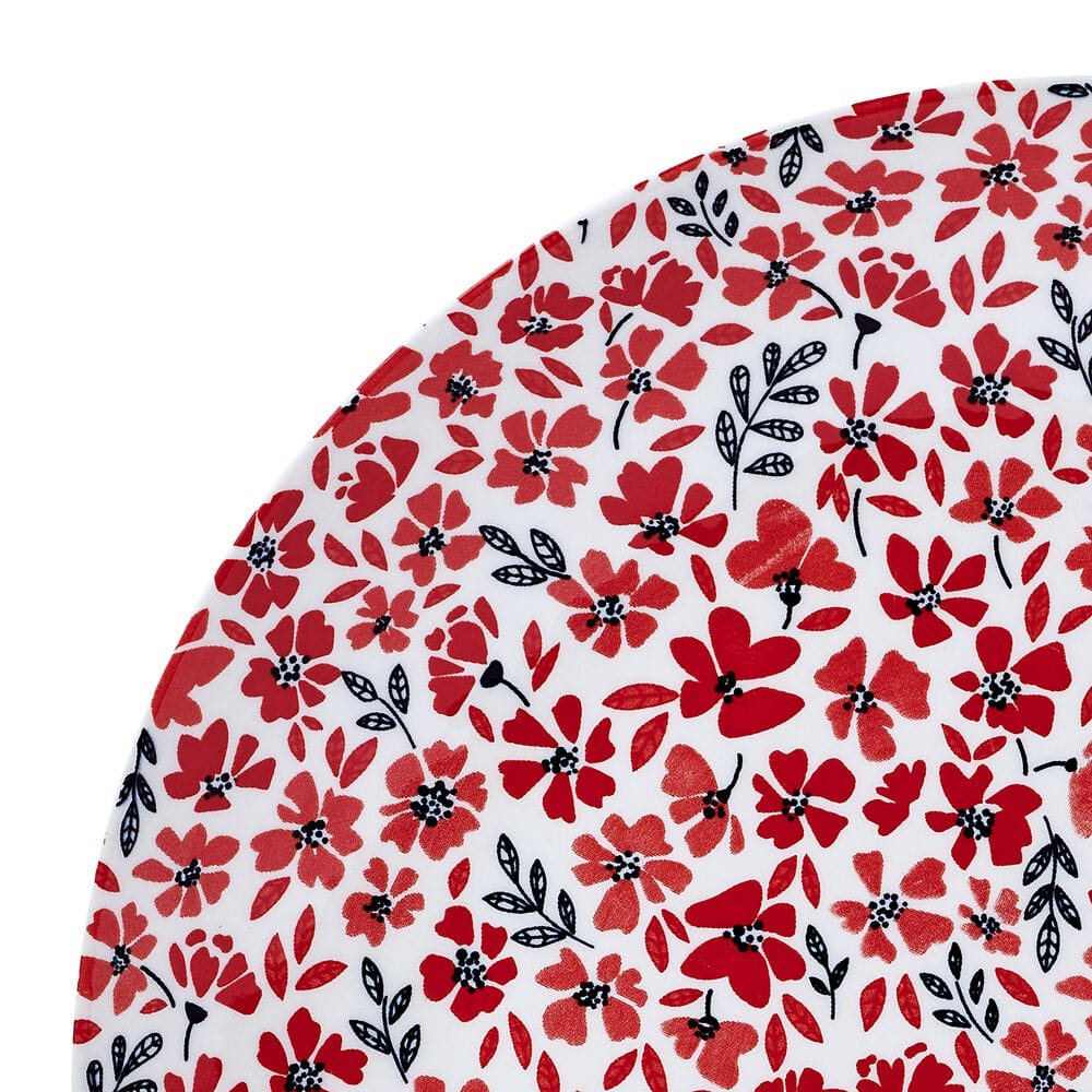Stacked set of bright, colorful dinnerware with floral design, ideal for entertaining