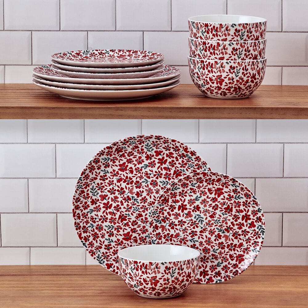 Close-up of colorful floral dinner plates with pink and red blossoms for family meals
