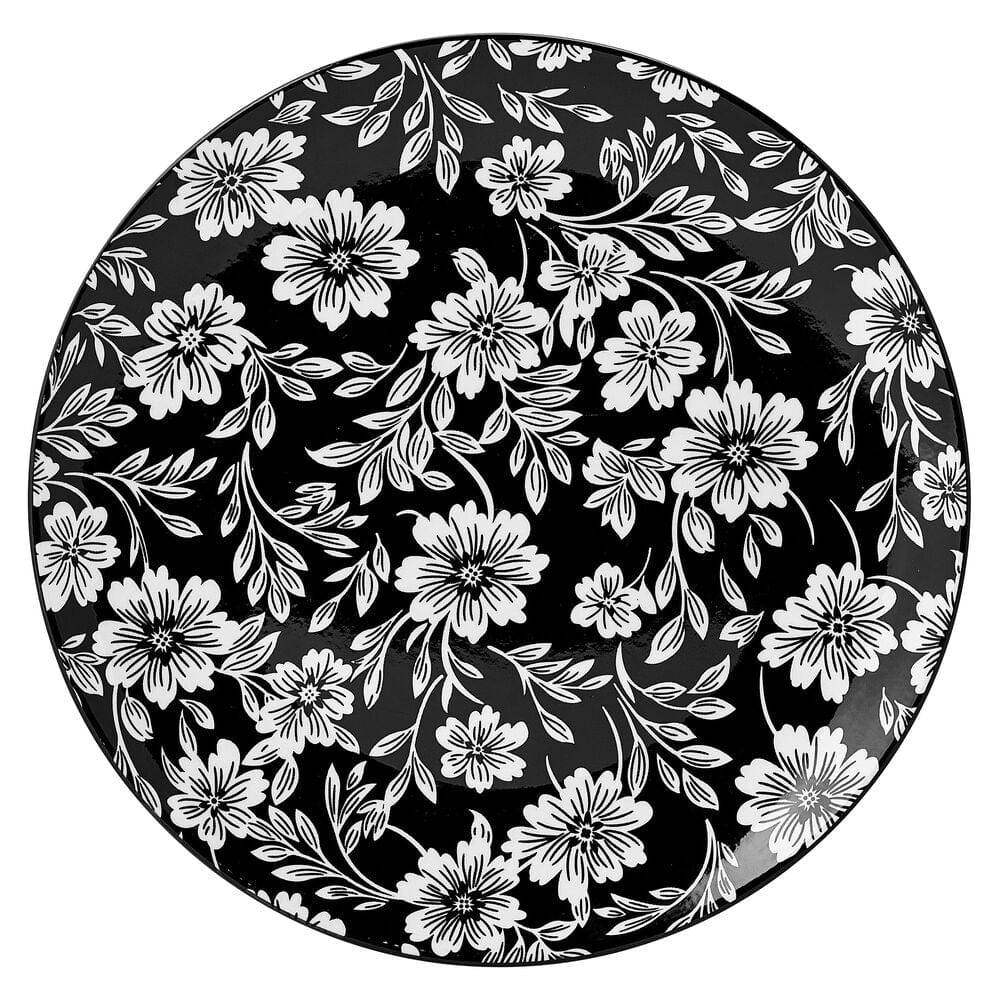 Stacked modern dinnerware featuring floral design, ready for serving at a dinner party