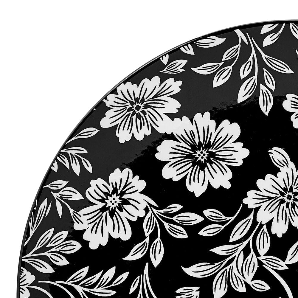 Stacked modern dinnerware featuring floral design, ready for serving at a dinner party