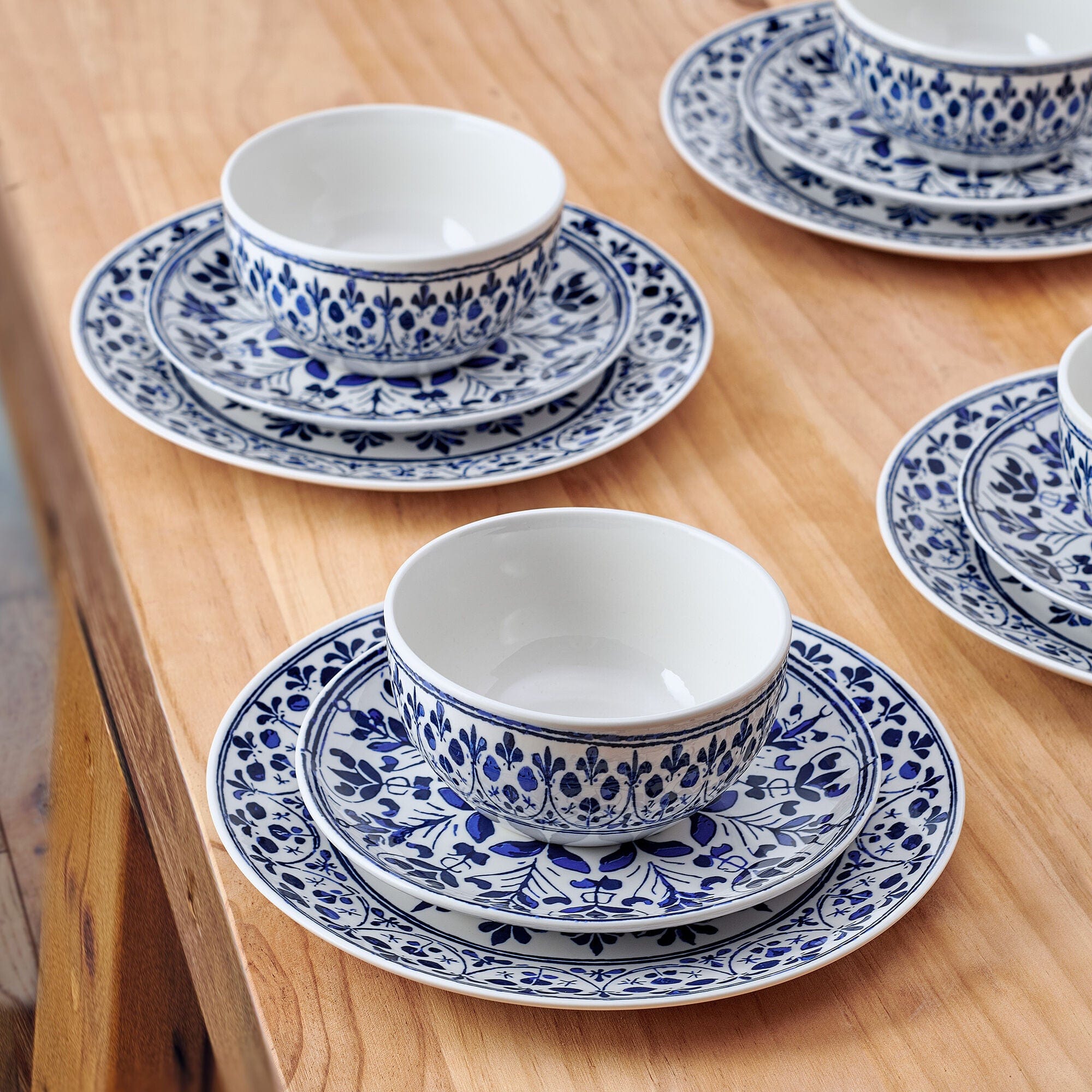 Close-up of floral medallion design on dinner plates for entertaining