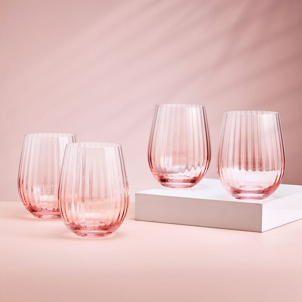 A close-up of the blush stemless wine glasses set, highlighting the vibrant ombre design.
