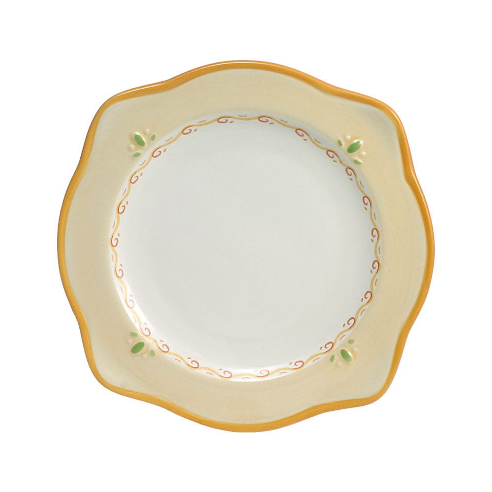Four-piece set of stoneware scalloped plates, microwave and dishwasher safe.