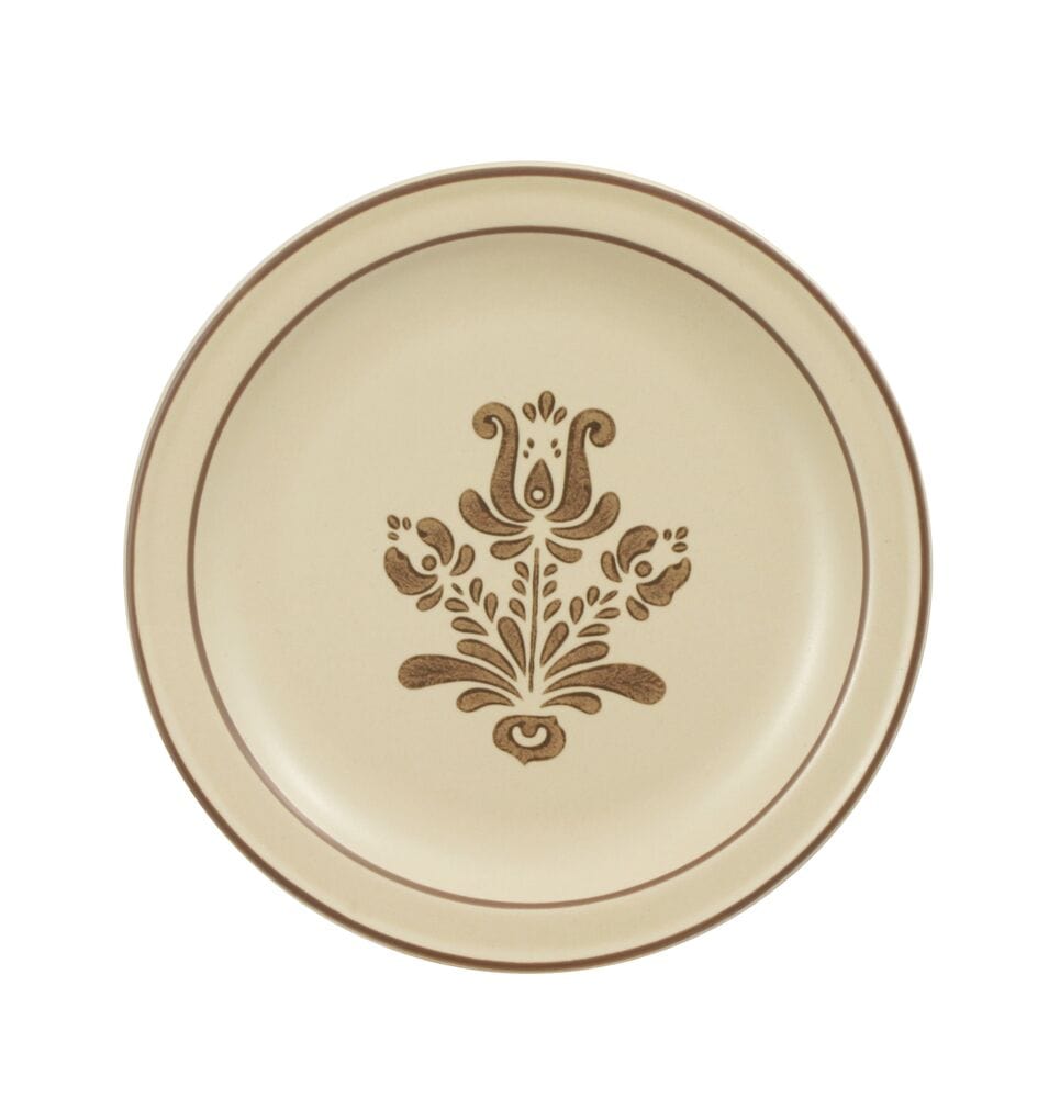 Side view of stoneware plates with sandwiches and chips for lunchtime