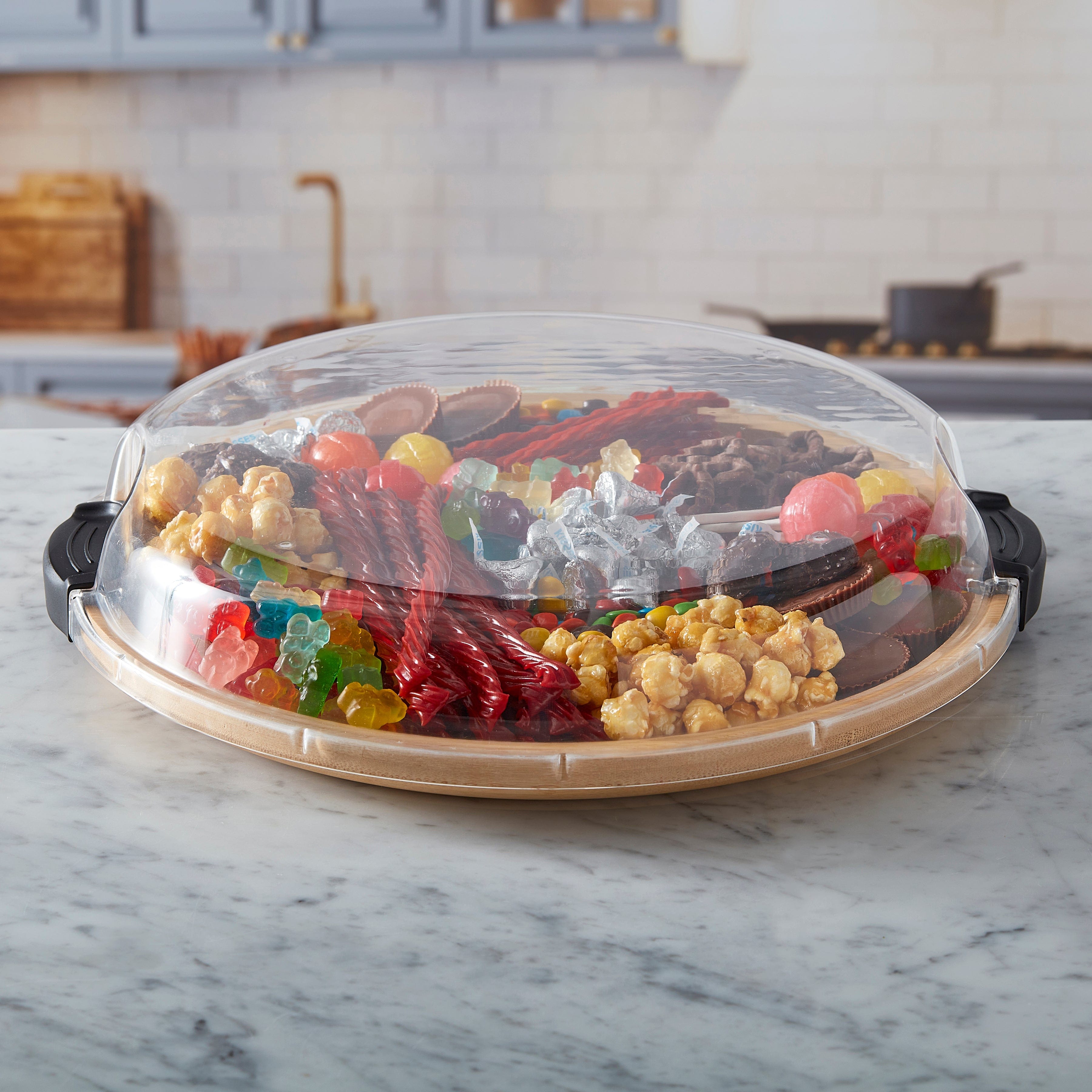 Versatile Culinary Board with clear lid showing arranged cheeses and fruits