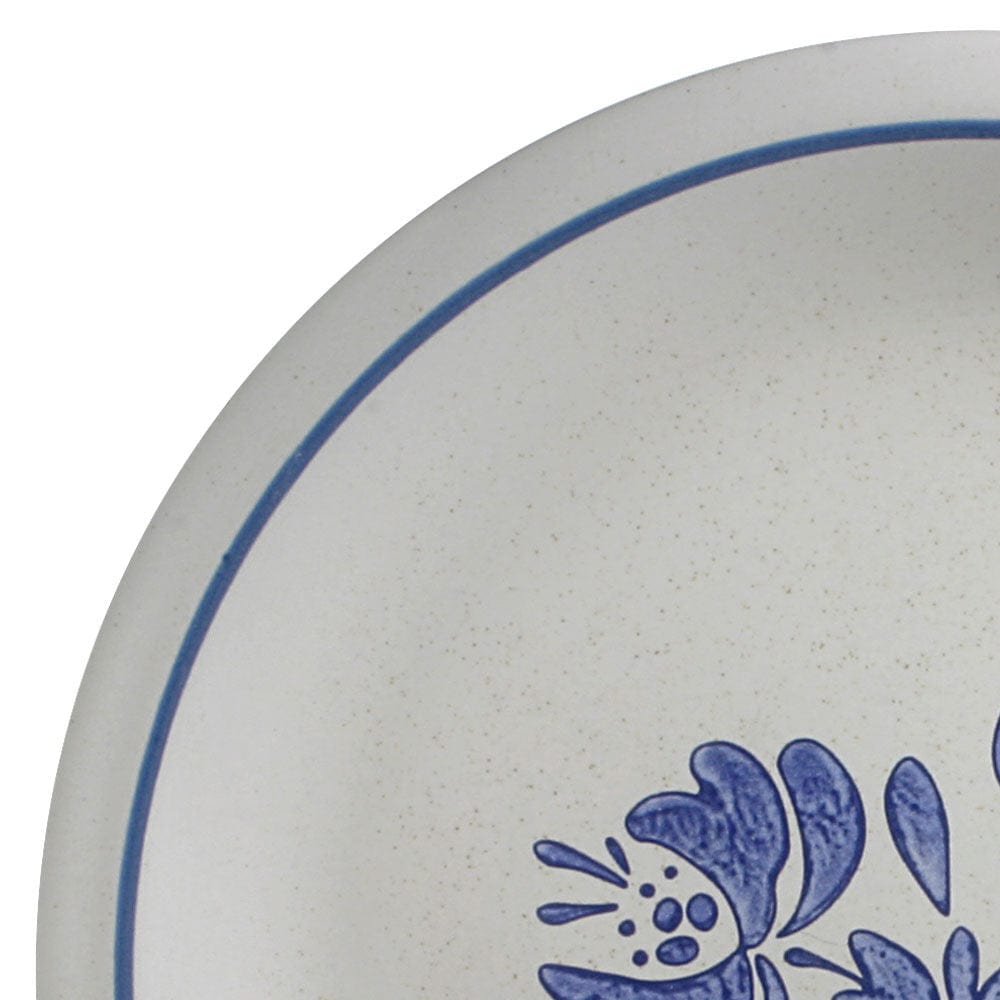 Set of four microwave-safe dinner plates displayed on a dining table