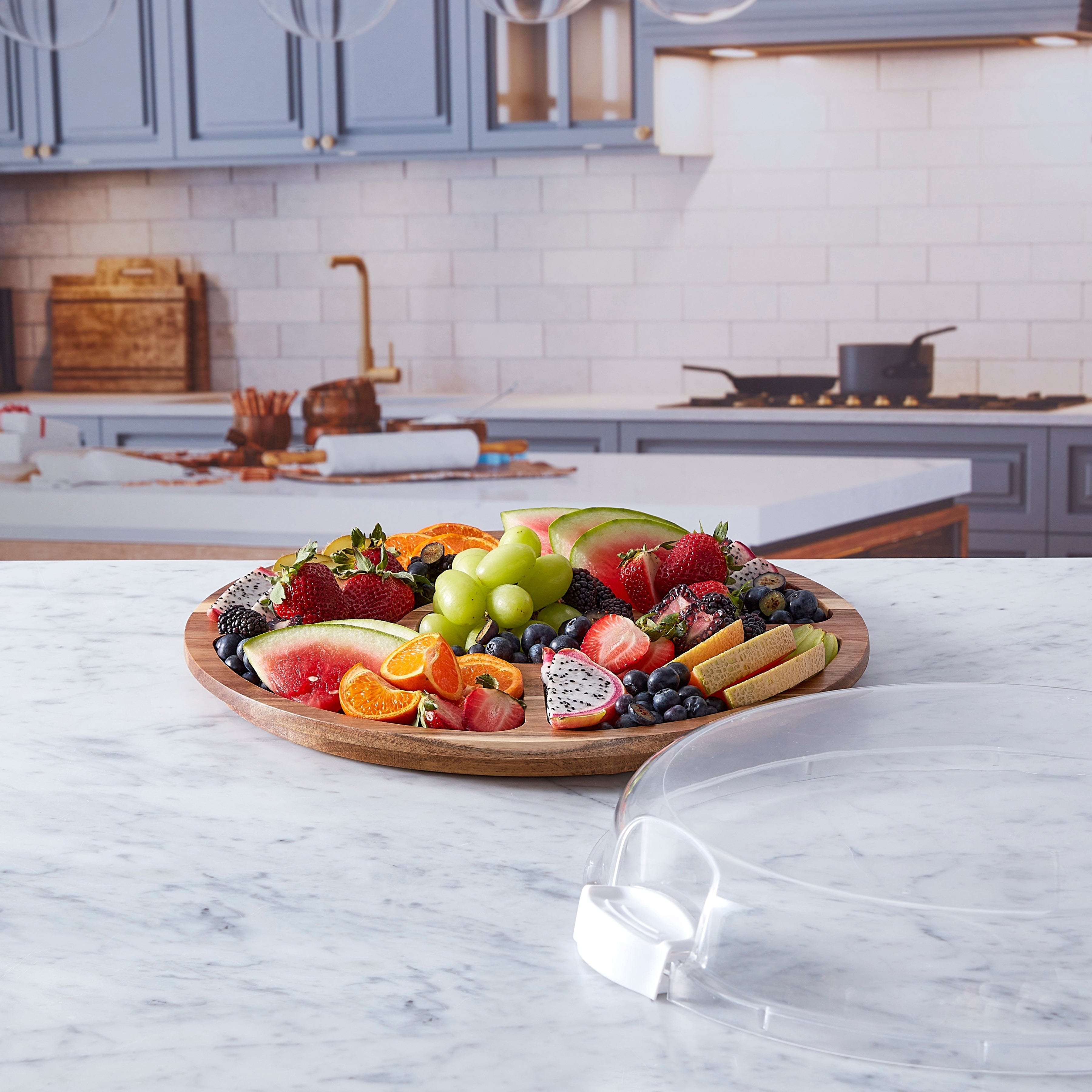 Versatile Culinary Board with clear lid showing arranged cheeses and fruits