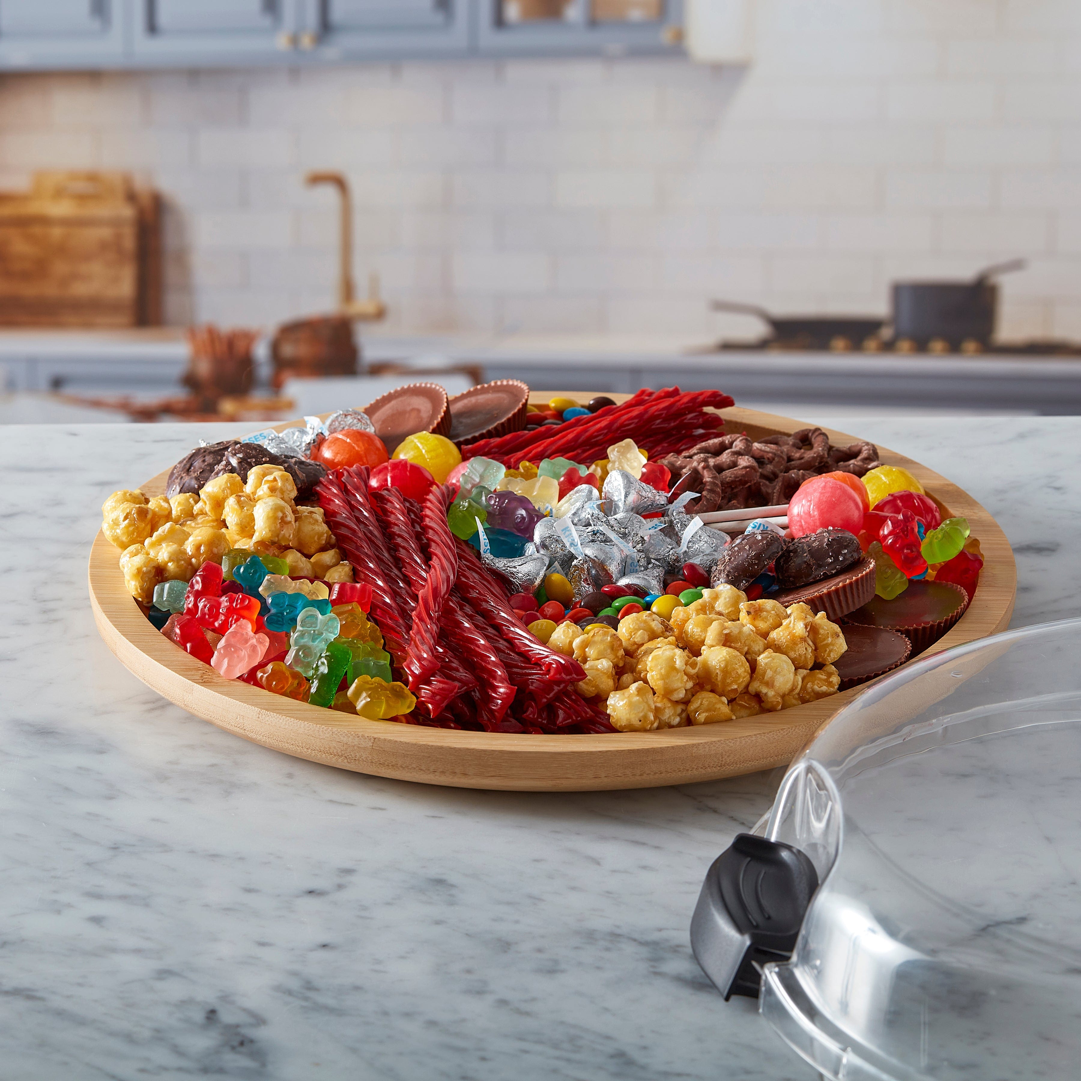 Versatile Culinary Board with clear lid showing arranged cheeses and fruits