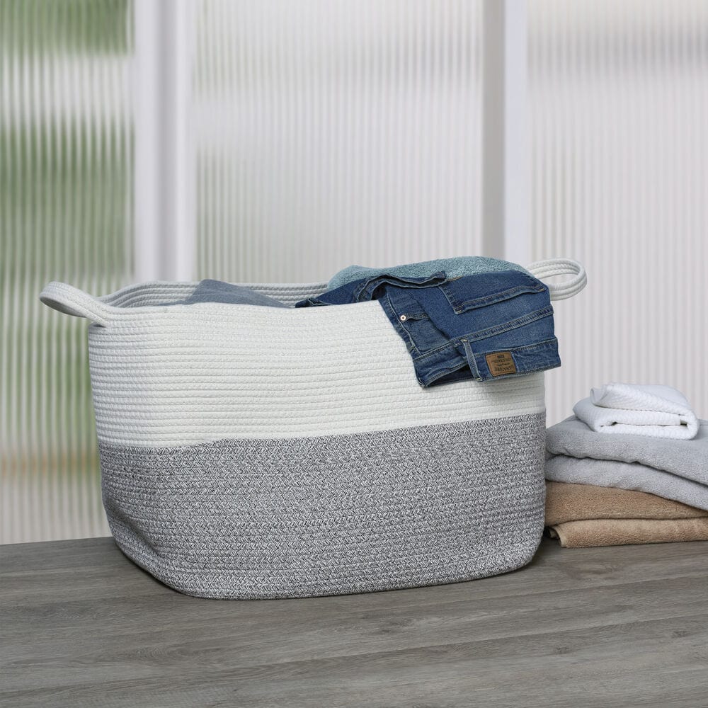 Large woven basket used as a stylish storage solution in a modern home