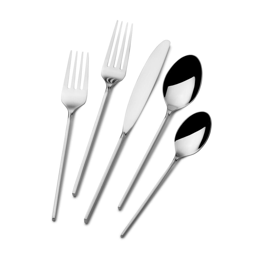 Flatware set arranged on a modern dinner table for a formal meal