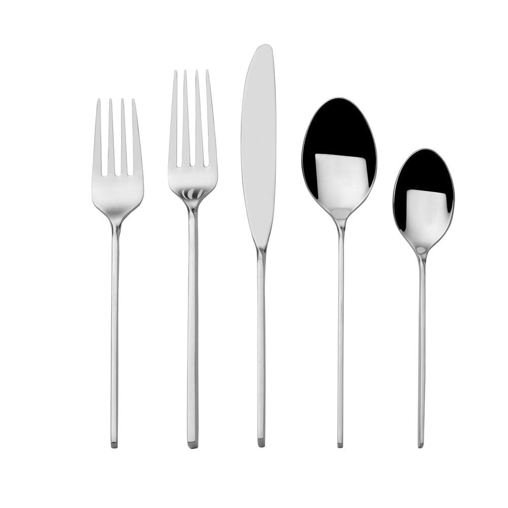 Flatware set arranged on a modern dinner table for a formal meal