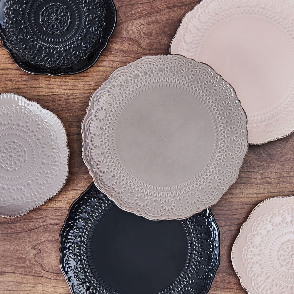 Modern dinner plate with lace design displayed in a close-up view