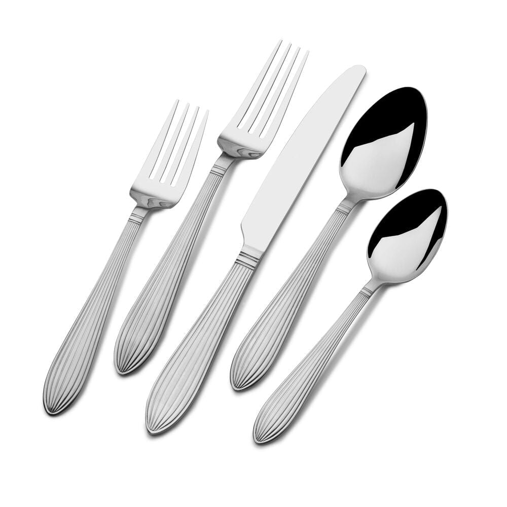 Top view of flatware set with dinner utensils arranged neatly for a party of four
