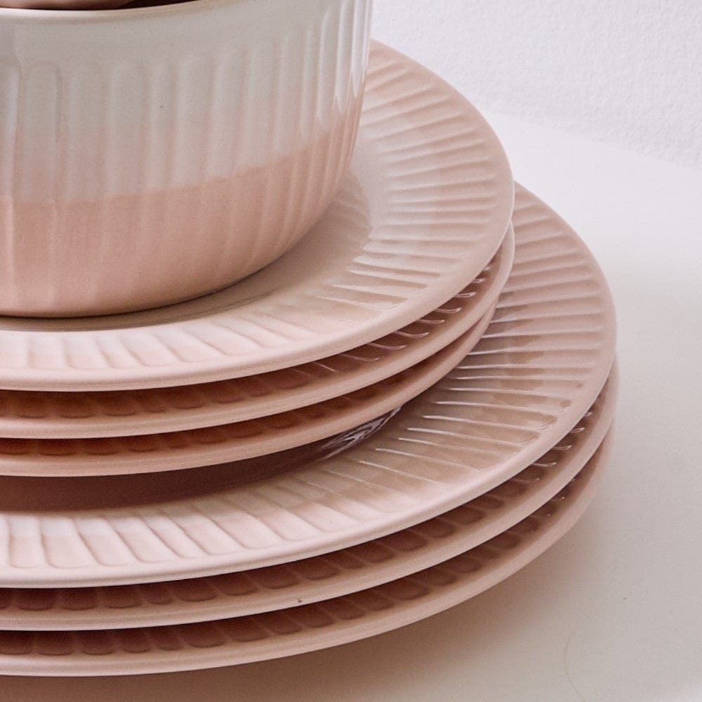 Family setting with stylish blush stoneware dinner plates and bowls