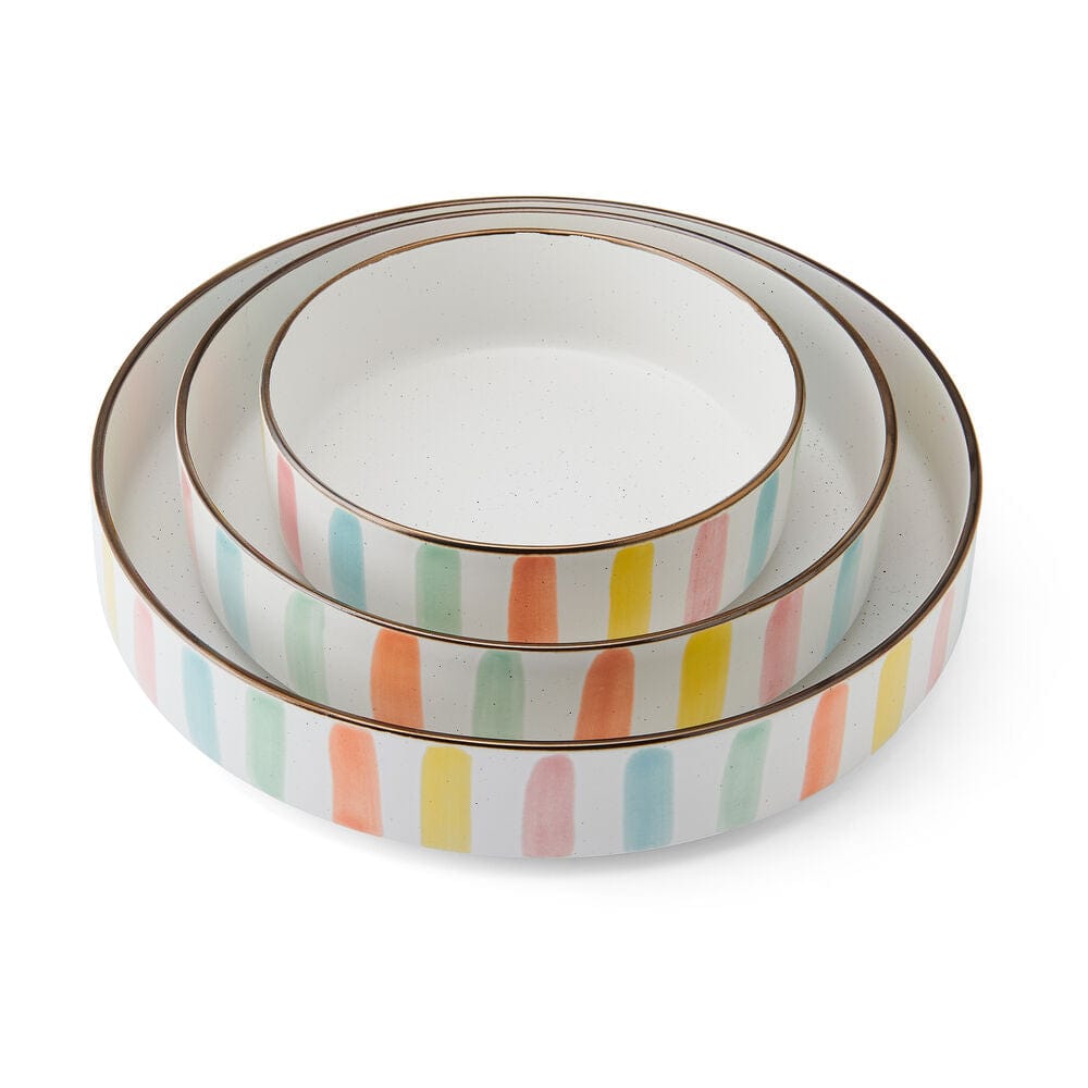 Close-up of vibrant striped dinnerware set ideal for summer dining