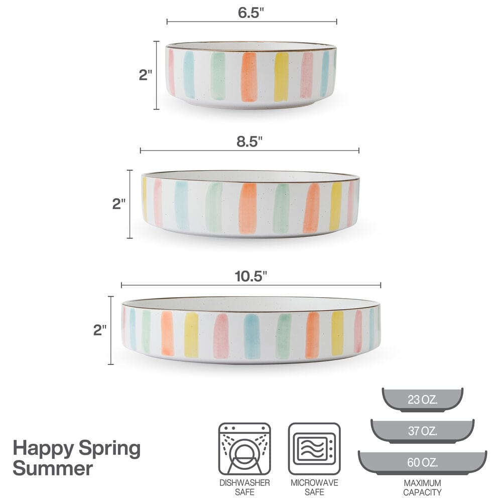 Colorful summer stoneware bowls arranged on a table for entertaining