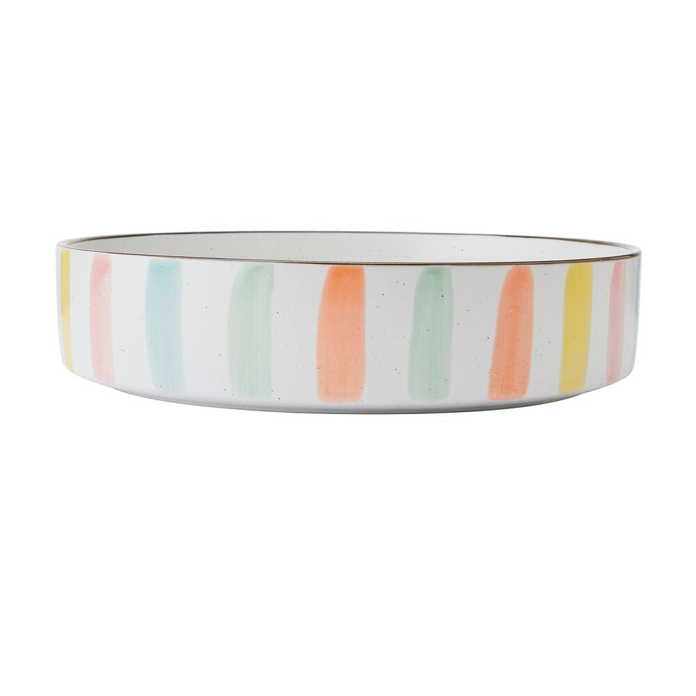 Close-up of vibrant striped dinnerware set ideal for summer dining