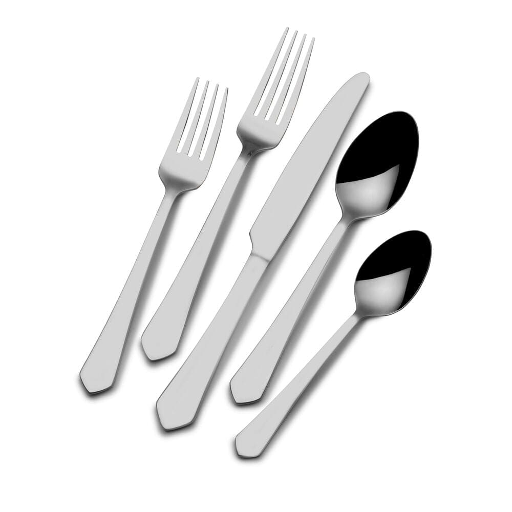 Almond 20-piece flatware set in use during a formal dinner setting.