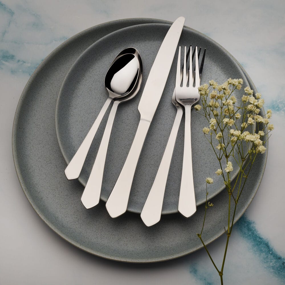 Close-up of the sleek finish of Almond Elegance flatware, perfect for family meals.