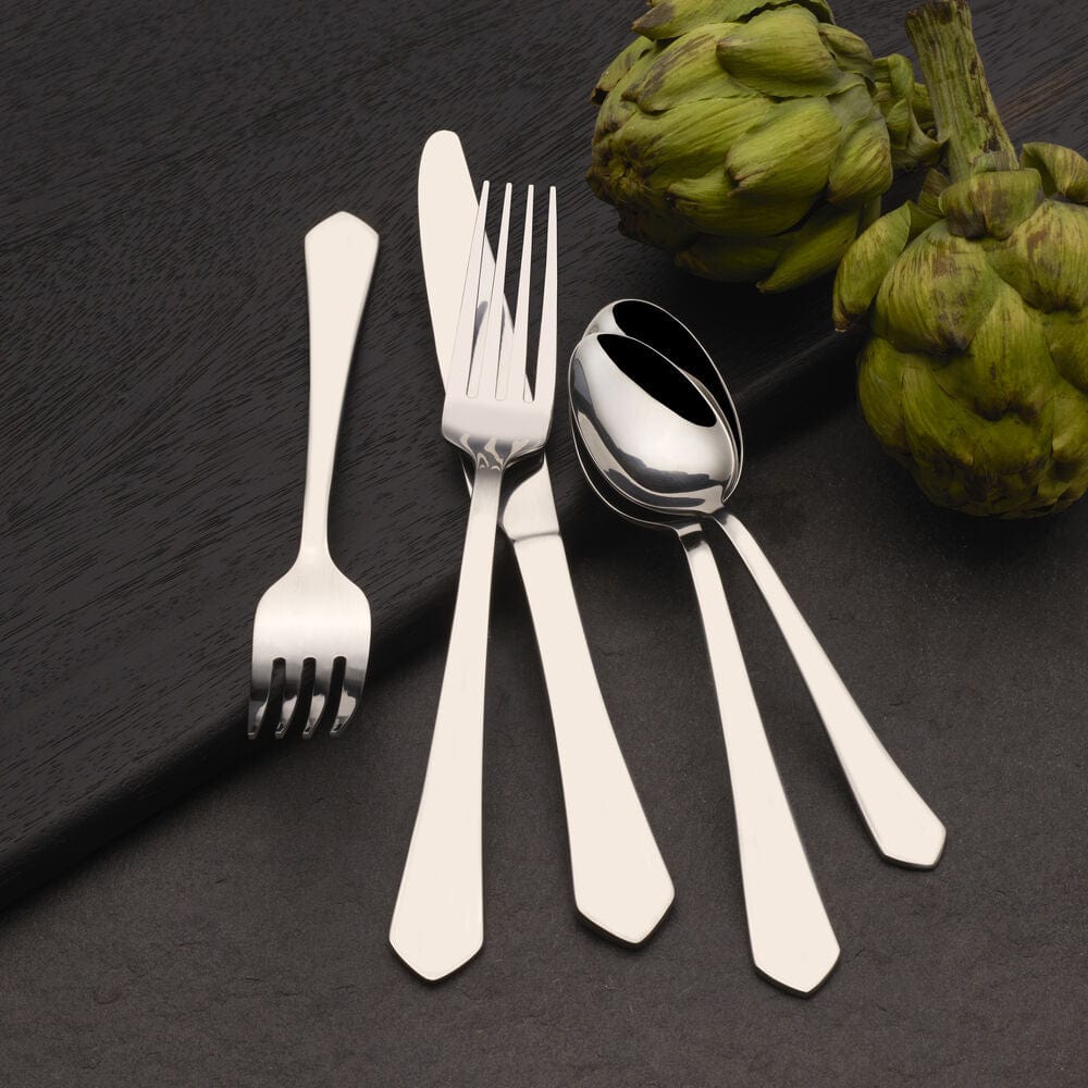 Almond 20-piece flatware set in use during a formal dinner setting.