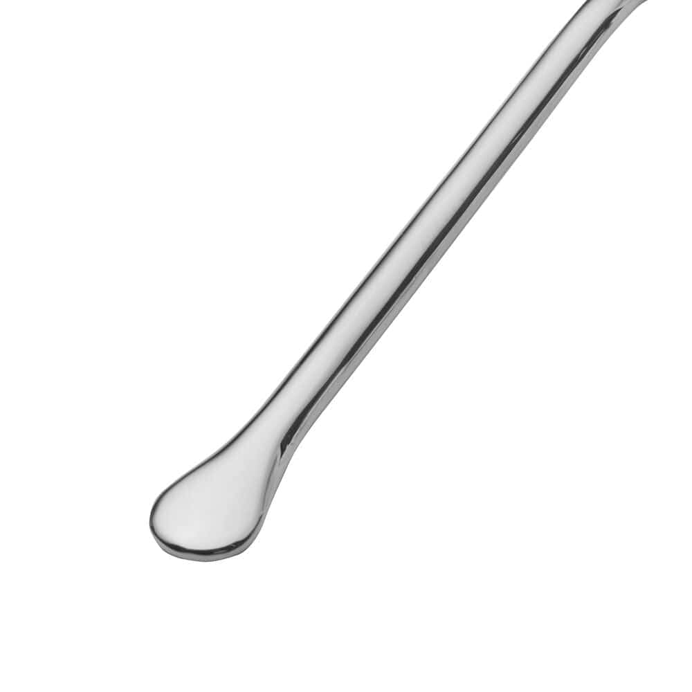 Close-up of Geneva Forged stainless steel flatware set on a modern dining table