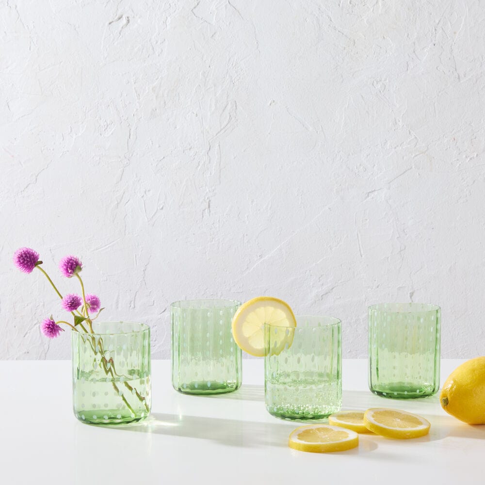 Close-up of Darbie Angell seafoam old fashioned glass with dotted cloud design, perfect for cocktails