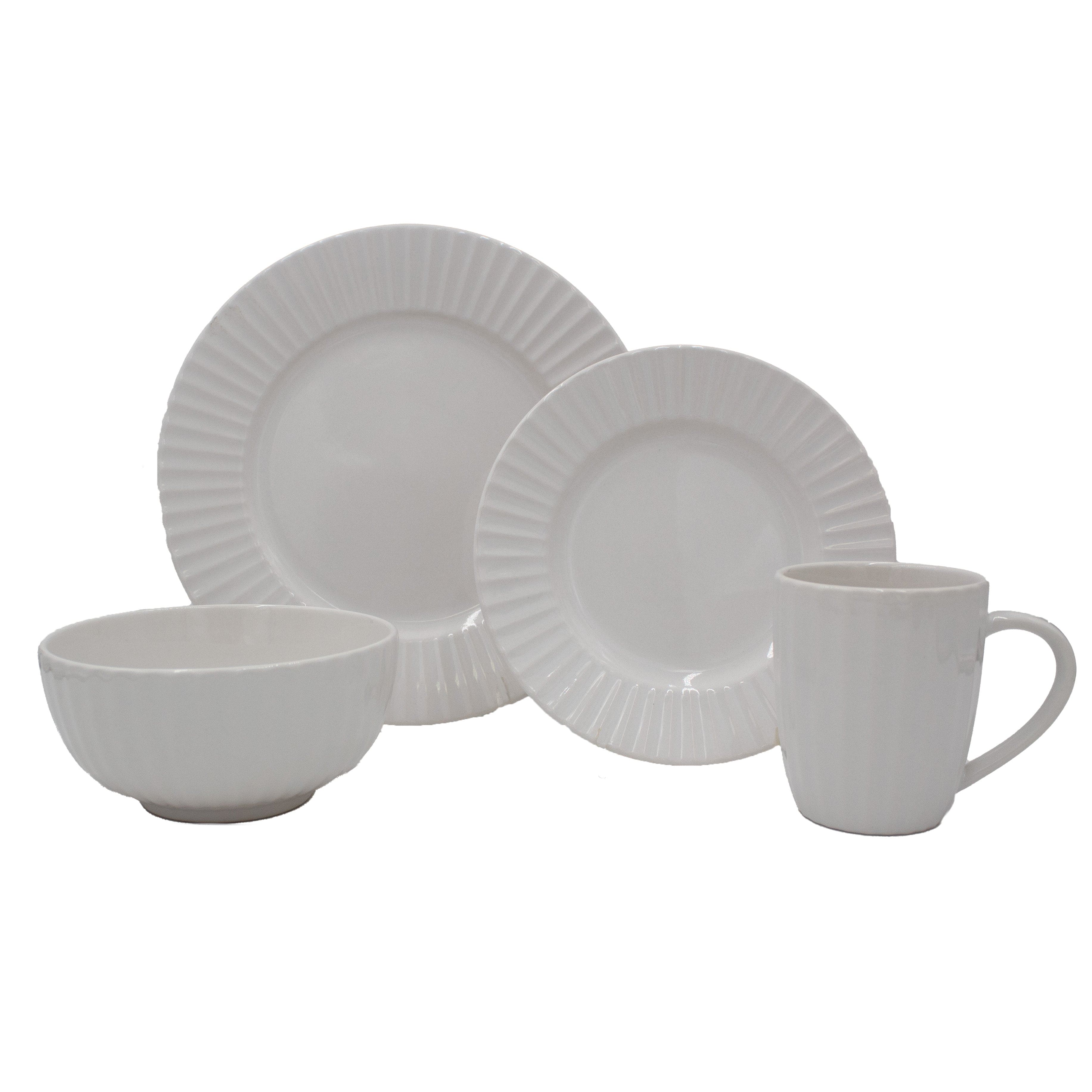 Elegant embossed white dinnerware set displayed on a dining table