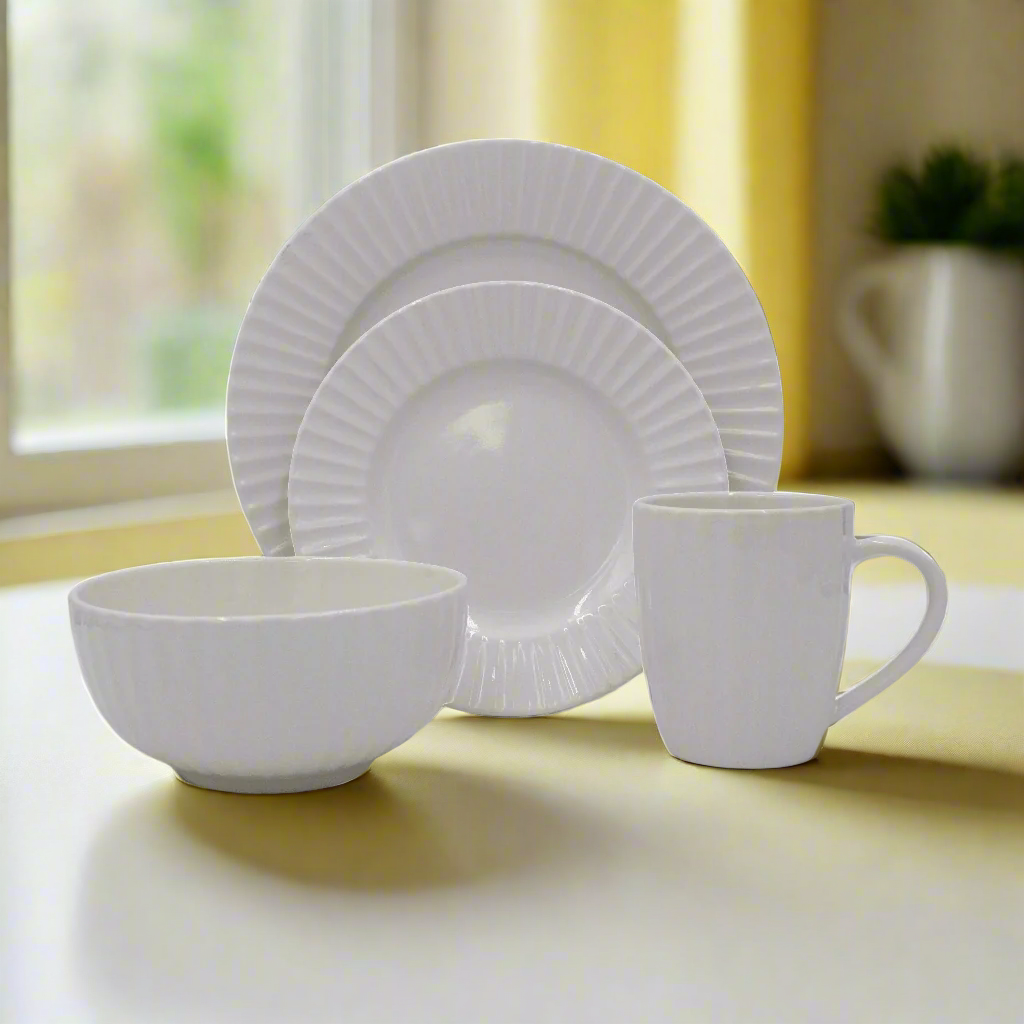 Elegant embossed white dinnerware set displayed on a dining table
