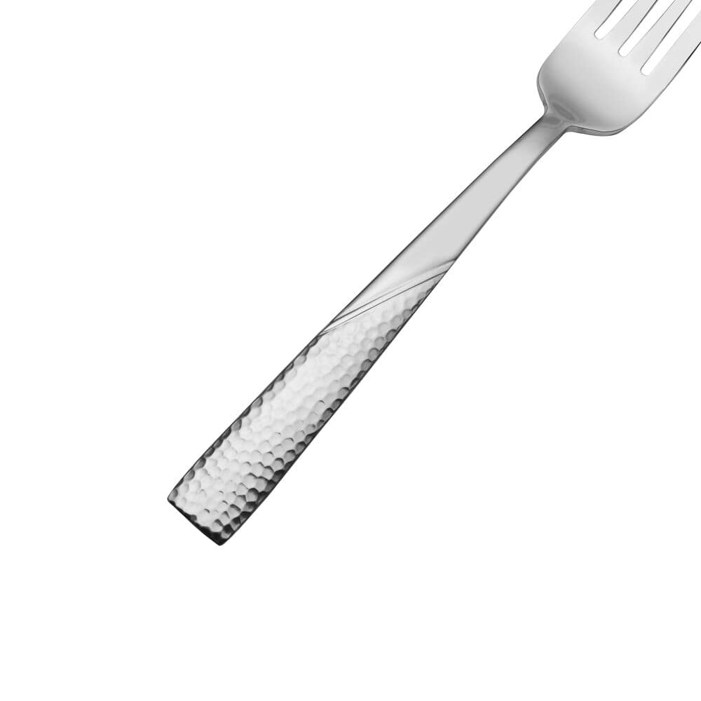Loring 34-piece stainless steel flatware set displayed on a dining table, showcasing its modern finish and elegant design.