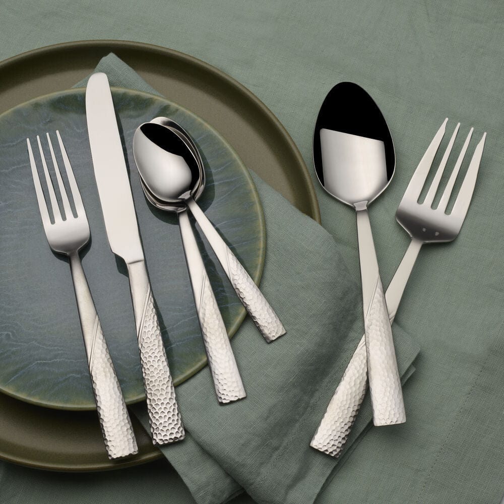 Close-up of the hammered texture on the Loring flatware set, highlighting the superior quality of the stainless steel.